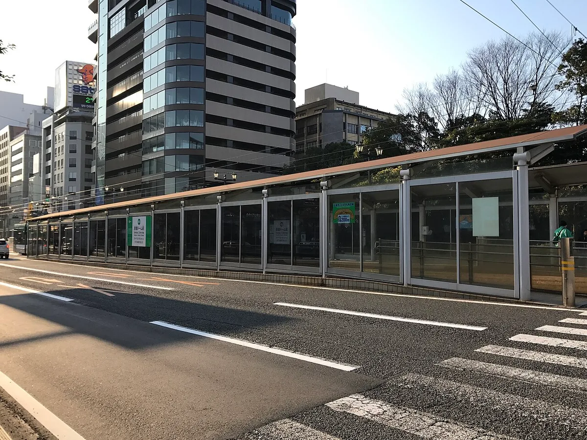 The covered platform of the Genbaku Dome-mae tram stop beside the road, Hiroshima