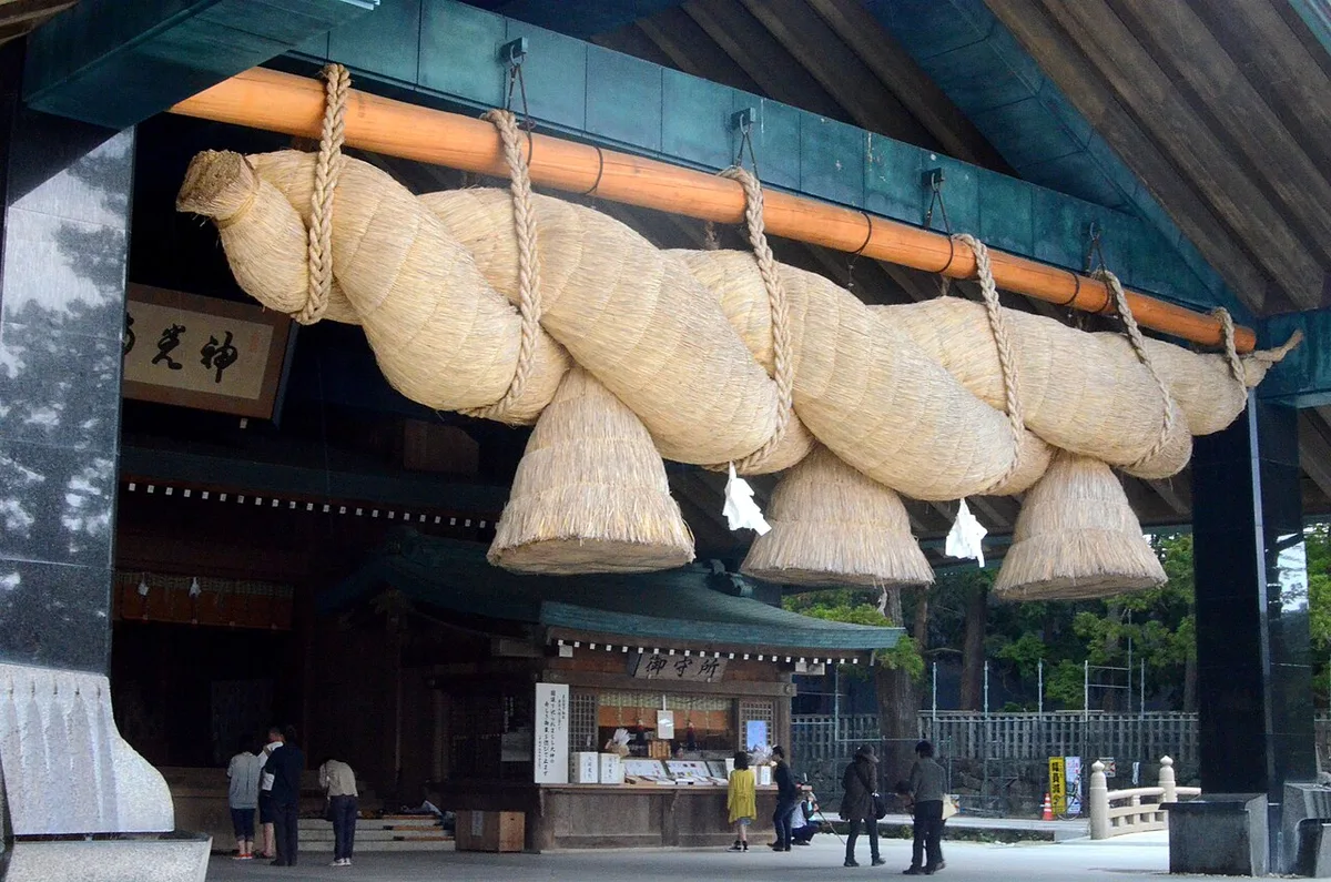 Giant straw shimenawa rope hanging at the Kaguraden hall of Izumo Taisha