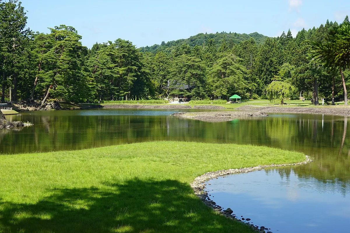 The Oizumi-ga-ike pond and grassy shore in the Pure Land garden at Motsuji