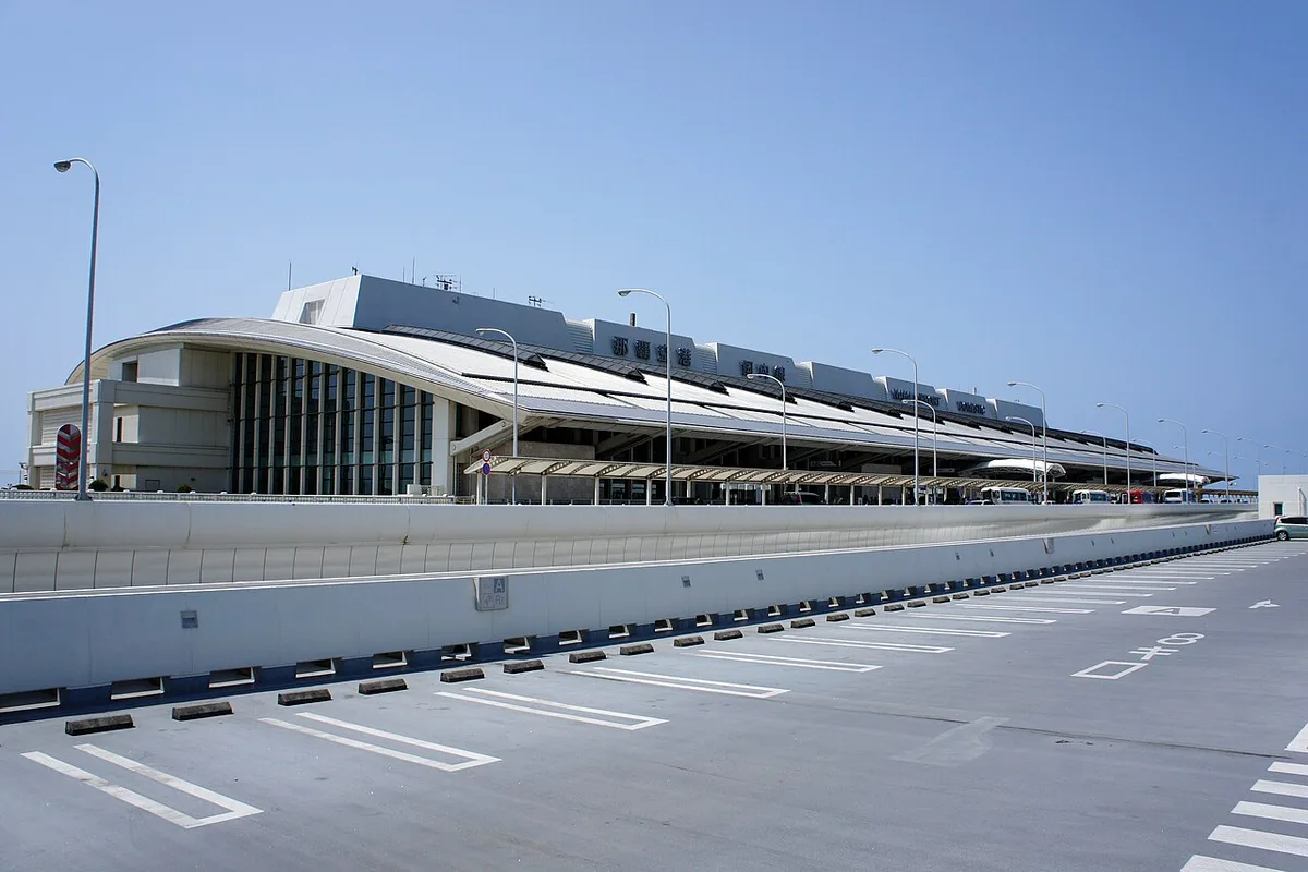 The domestic terminal building at Naha Airport seen from the car park road