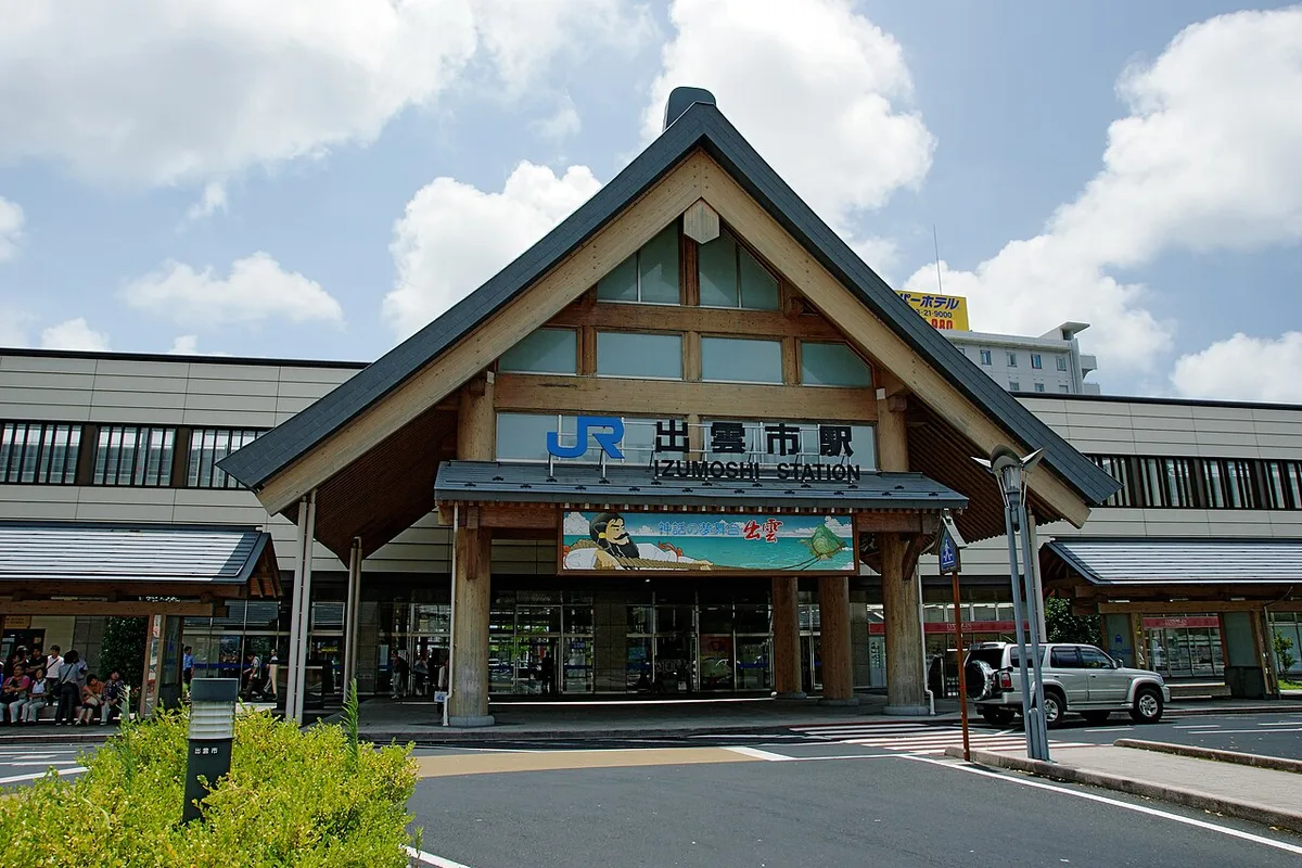 Front of JR Izumoshi Station with its tall timber-framed gable entrance